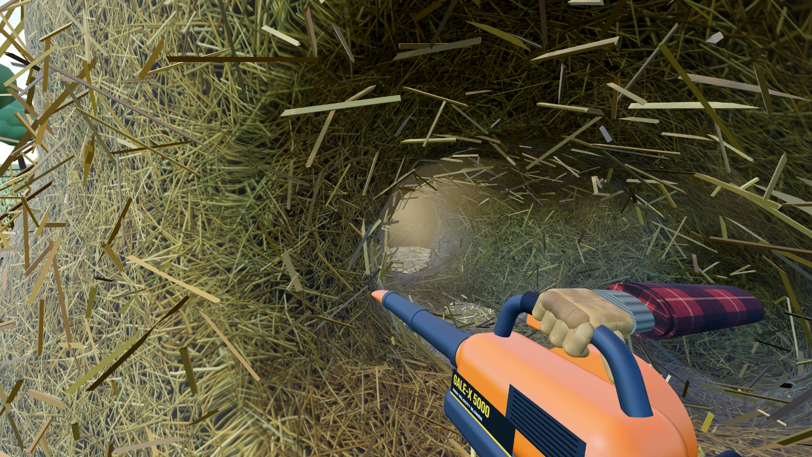 The orange Leaf Blower blasting a tunnel into the haystack